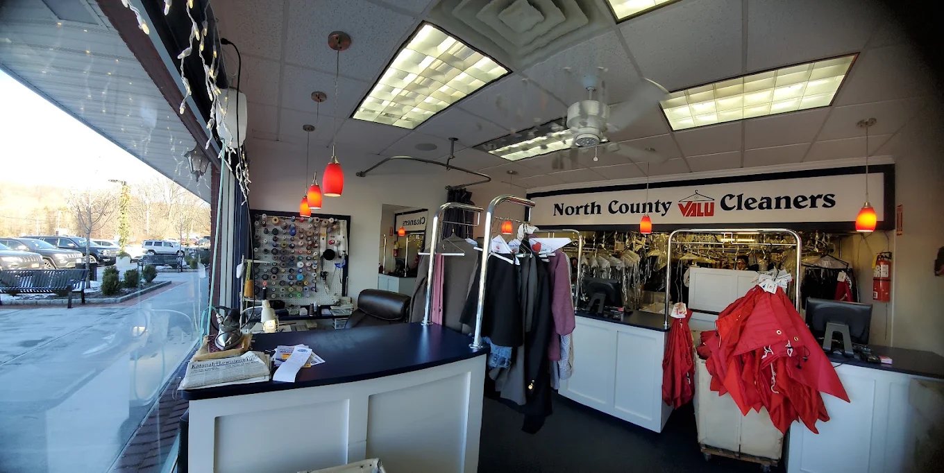 Inside the store: the front counter, thread wall and garment conveyor